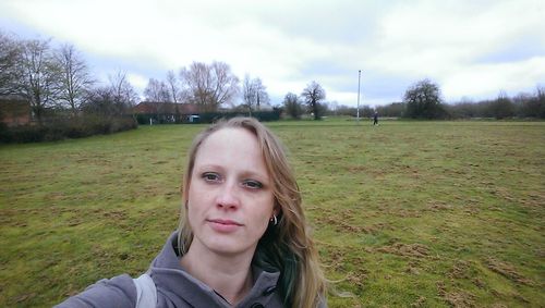 Portrait of man on field against sky