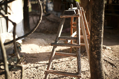 Old abandoned chair on field