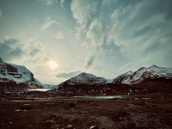 Scenic view of snowcapped mountains against sky