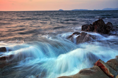 View of waterfall at sunset