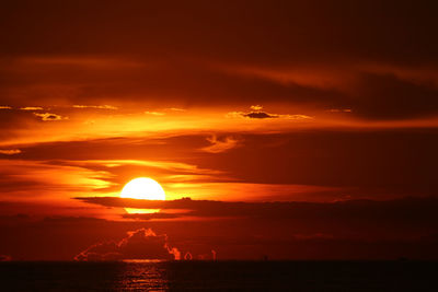 Scenic view of sea against romantic sky at sunset