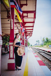 Full length of man standing on railroad platform