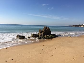 Scenic view of beach against sky