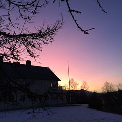 View of houses at sunset