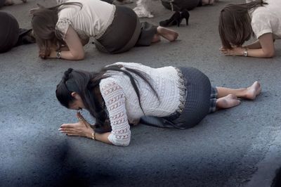 High angle view of people relaxing on street