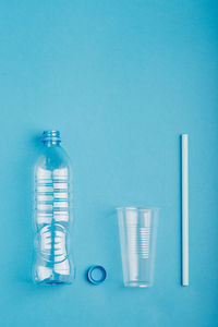 View of plastic bottles on blue background