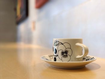Close-up of tea cup on table at home