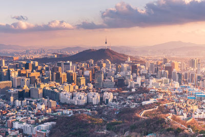 High angle view of city against sky during sunset