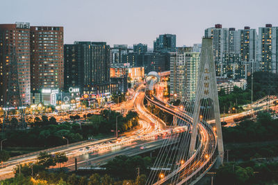 High angle view of illuminated cityscape against sky