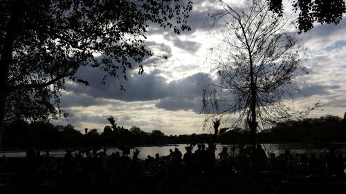 Scenic view of lake against cloudy sky
