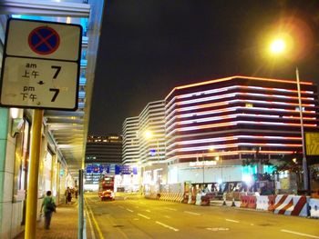 Information sign in city at night