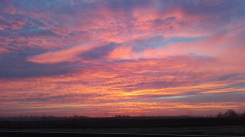 Scenic view of dramatic sky during sunset