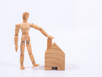 Sculpture of toy on table against white background