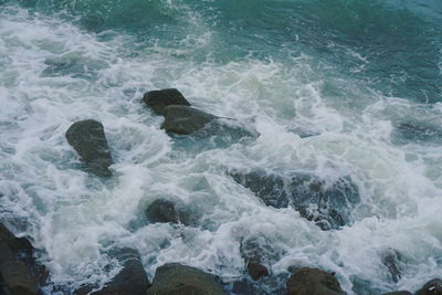 Waves splashing on rocks