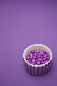 Close-up of purple candies in bowl