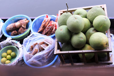 Fruits in basket for sale at market stall