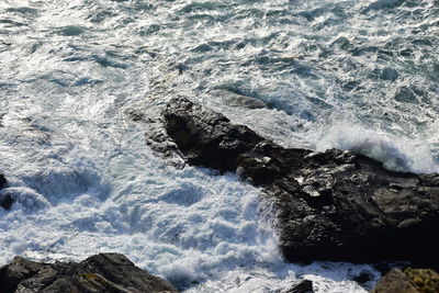 Sea waves splashing on rocks