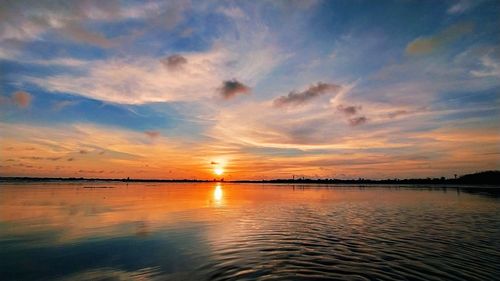 Scenic view of sea against romantic sky at sunset