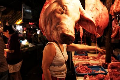 Midsection of woman at market stall