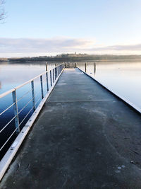 Pier over sea against sky