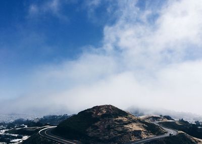 Scenic view of mountain road against sky