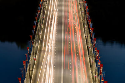 High angle view of light trails on river at night