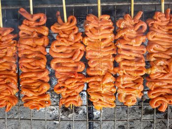 Close-up of sausages on barbecue grill