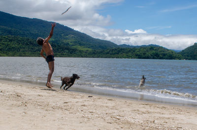 Woman with dog on beach