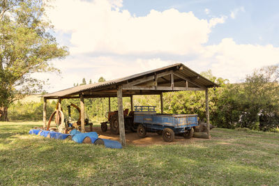 Built structure on field against sky