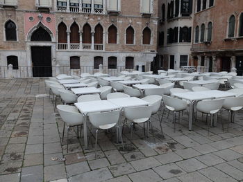 Empty chairs and tables in a row