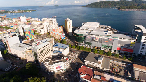 High angle view of buildings by sea