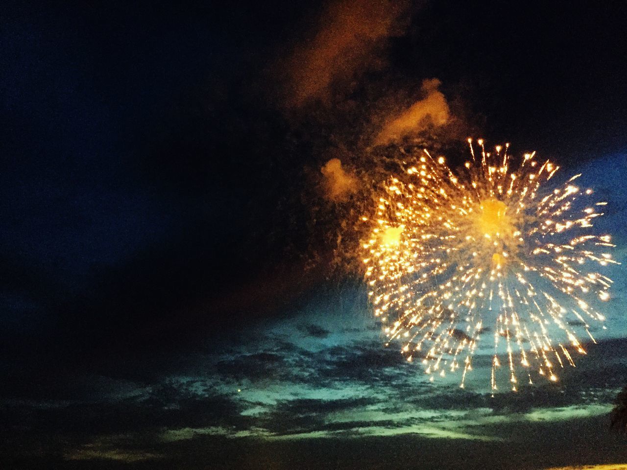 night, illuminated, sky, glowing, long exposure, arts culture and entertainment, low angle view, firework display, exploding, motion, celebration, fire - natural phenomenon, lighting equipment, sparks, light - natural phenomenon, dark, outdoors, firework, firework - man made object, blurred motion