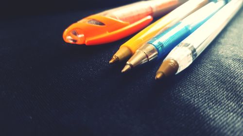 Close-up of multi colored pencils on table