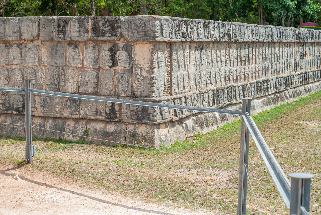 VIEW OF STONE WALL BY RAILING