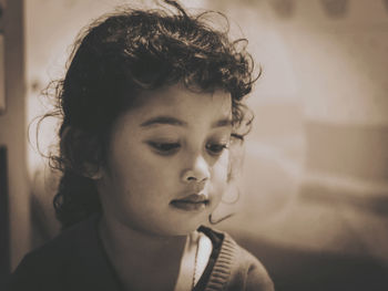 Close-up portrait of teenage girl at home