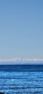 View of sea against blue sky