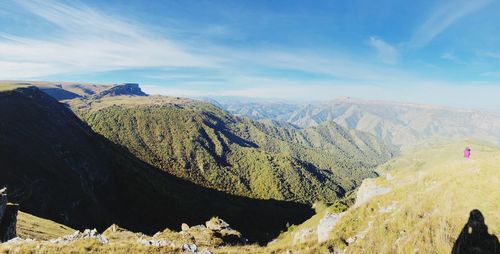 Panoramic view of landscape and mountains against sky