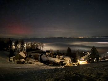 Scenic view of landscape against sky at night
