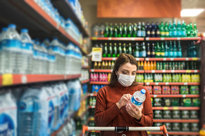 Full length of man standing at store