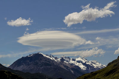 Scenic view of snowcapped mountains against sky and lentil cloud