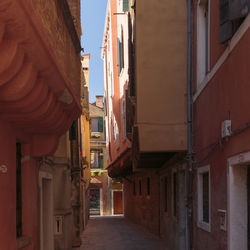 Narrow alley amidst buildings in town