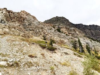 Low angle view of rock formation against sky