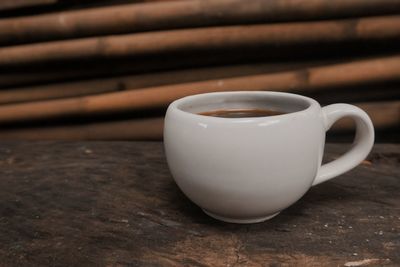 Close-up of coffee cup on table