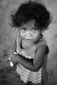 Portrait of girl standing on field