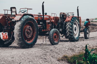 Tractor on field against sky