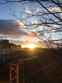 View of railroad tracks against sky during sunset