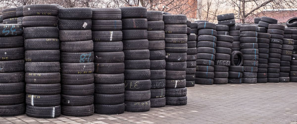 Used tire stacks in workshop vulcanization yard