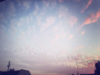 Low angle view of cloudy sky at sunset