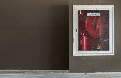 Close-up of glass window on wall