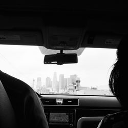 City street seen through car window